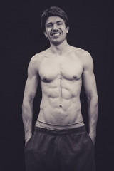 Fototapeta premium Portrait of a Muscular man in a studio