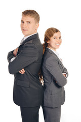 two persons in suits standing