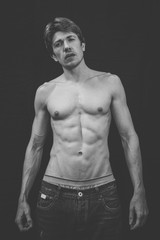 Naklejka premium Portrait of a Muscular man in a studio