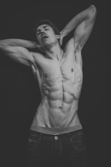 Naklejka premium Portrait of a Muscular man in a studio