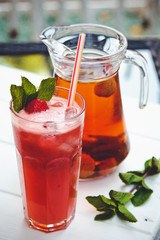 Fresh cold strawberry tea with ice and mint