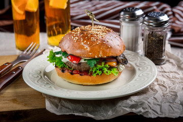 Sandwich with chicken burger, tomatoes, cheese and lettuce