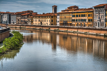 Pisa lungarno under a dramatic sky