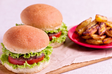 Burger with beef, tomato and herbs.