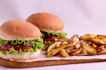 Burger with beef, tomato and herbs.