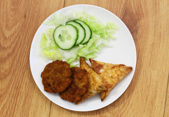 Indian samosas and pakoras with side salad
