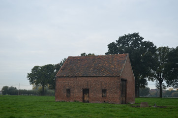 Fototapeta na wymiar Small house in countryside landscape