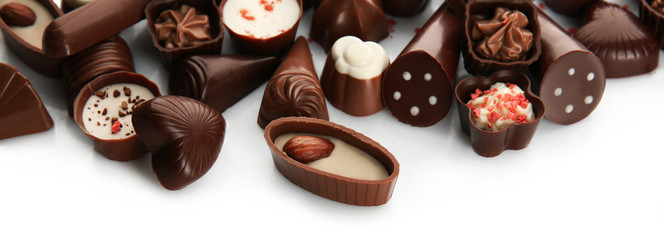 Assorted chocolate candies, isolated on white
