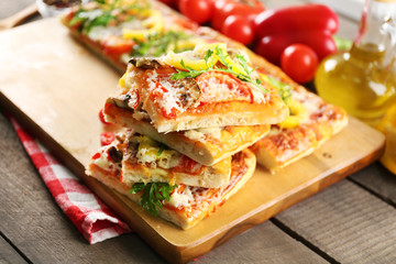 Pieces of delicious pizza on the table, close-up