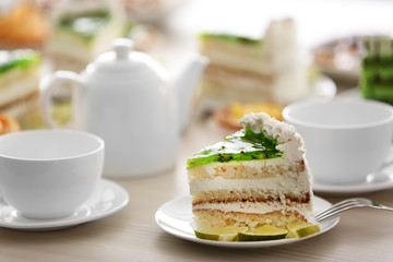 Piece of lime cake on table