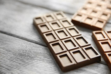 Chocolate bars  on wooden background