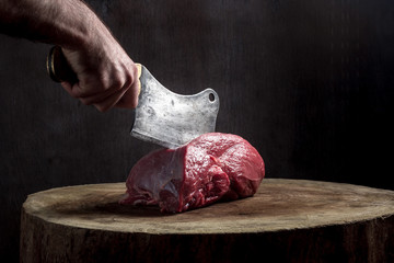 Juicy raw beef steak on wooden table