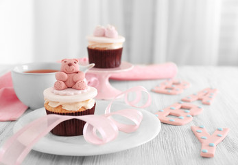 Decorative cupcakes on table
