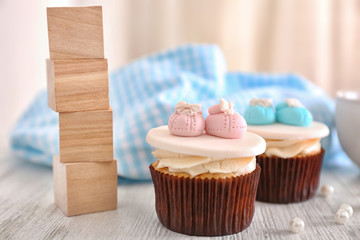 Delicious cupcakes with wooden cubes