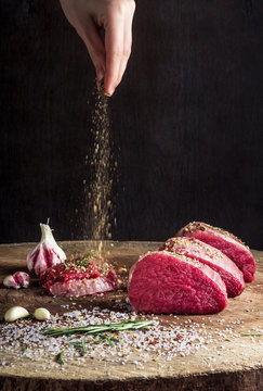 Juicy Raw Beef Steak On Wooden Table