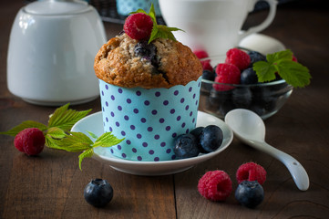Muffins with blueberries and raspberries, summer, healthy breakfast, selective focus, toned image