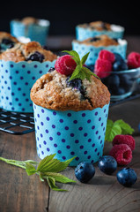 Muffins with blueberries and raspberries, summer, healthy breakfast, selective focus, toned image