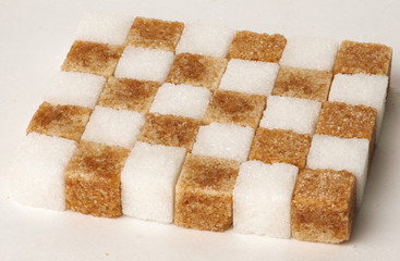 Cubes of sugar cane brown and white refined isolated