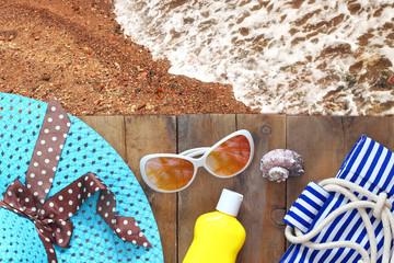 sea sand and wooden deck with beach accessories