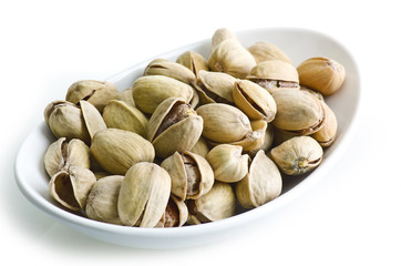 Group of pistachio nuts isolated on a white