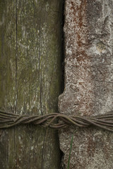 old wood, concrete and rusted steel wire