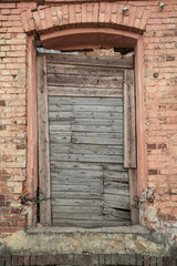 Fototapeta na wymiar Window of a old brick house