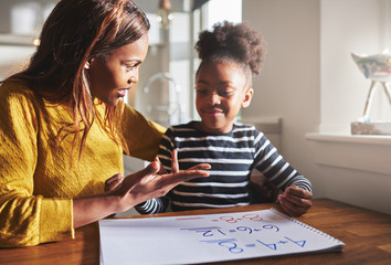 Mom learning daughter to calculate