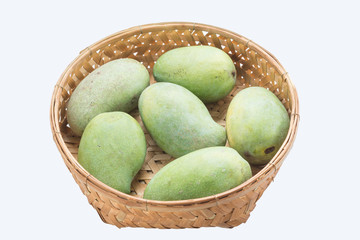 Fruits series : Six green mangoes in wicker basket
