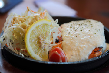 Selective focus of lemon in tuna salad food. Food background.