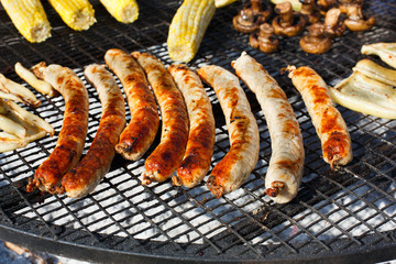 Street fast food, grilled sausages at bbq
