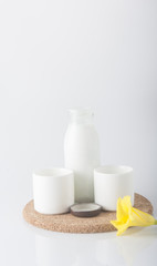 Milk with flower on white background