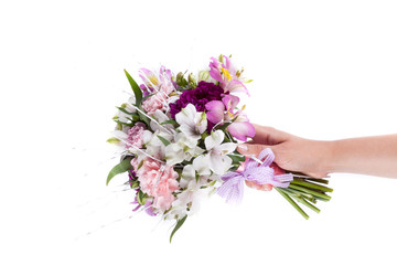 Hand holding a pink bouquet from gillyflowers and alstroemeria o