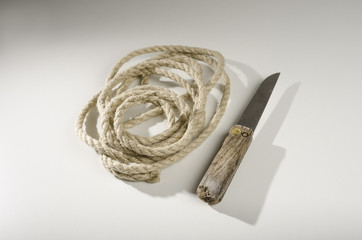 Knife and twisted natural hemp rope