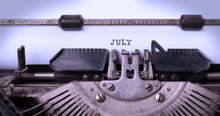 Fototapeta na wymiar Old typewriter - July