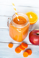 Orange smoothie from carrot and apple.