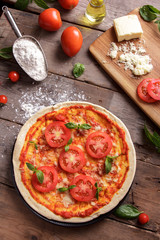 italian homemade pizza with ingredients