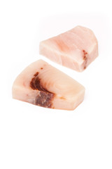 Swordfish steak portions isolated on a white studio background.