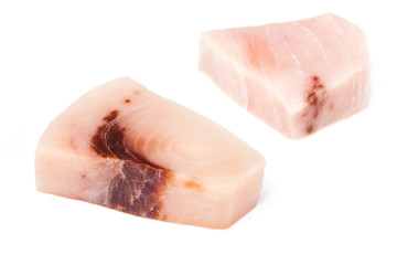 Swordfish steak portions isolated on a white studio background.