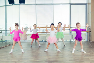 happy children dancing on in hall, healthy life, kid's togetherness and happiness concept