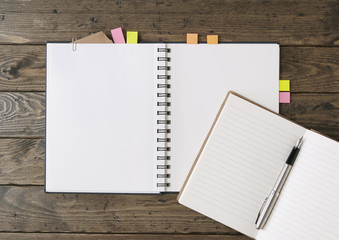 Notebooks and journals - writers diary and artists sketchbook with page markers open on blank pages, on a rustic desk top background