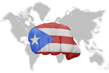 fist with the national flag of puerto rico on a world map background