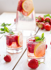 fresh lemonade with strawberries , lemon and mint