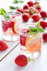 fresh lemonade with strawberries , lemon and mint