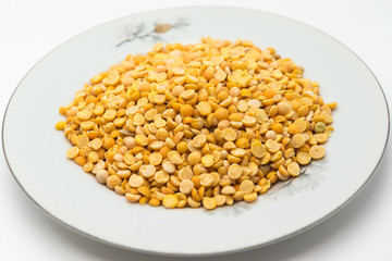 Dried split peas on a white plate