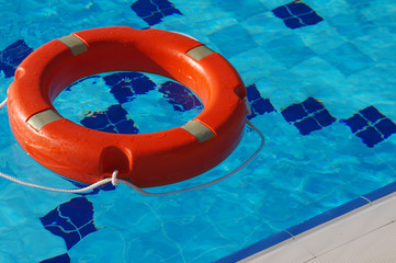 Life ring in the pool. Life Ring on blue water.