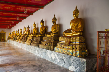 Golden Buddha Statue In Row At Wat Po Temple
