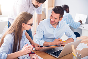 Fototapeta premium Pleasant colleagues discussing project