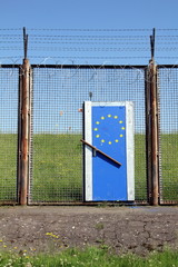 Symbolic European Border illustrating Europe's doors are closed (The barbed wire fence is not at the European border. It's a remainder of the former customs border of the harbour in Hamburg.)