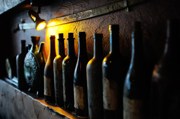 Bottles with old wine in a cellar