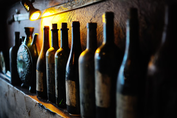 Bottles with old wine in a cellar
